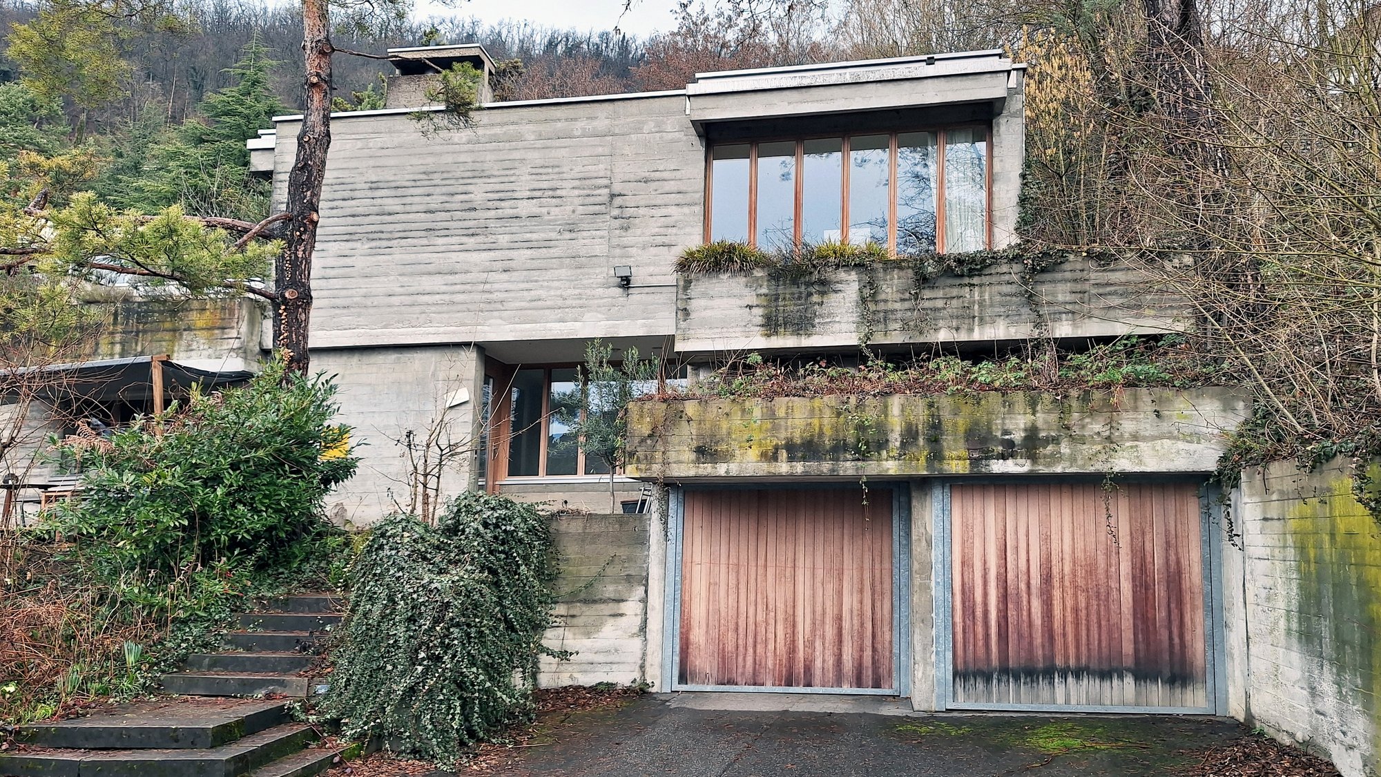 Concrete building with heavy algae and lichen growth, Schartentrottenstrasse, Baden