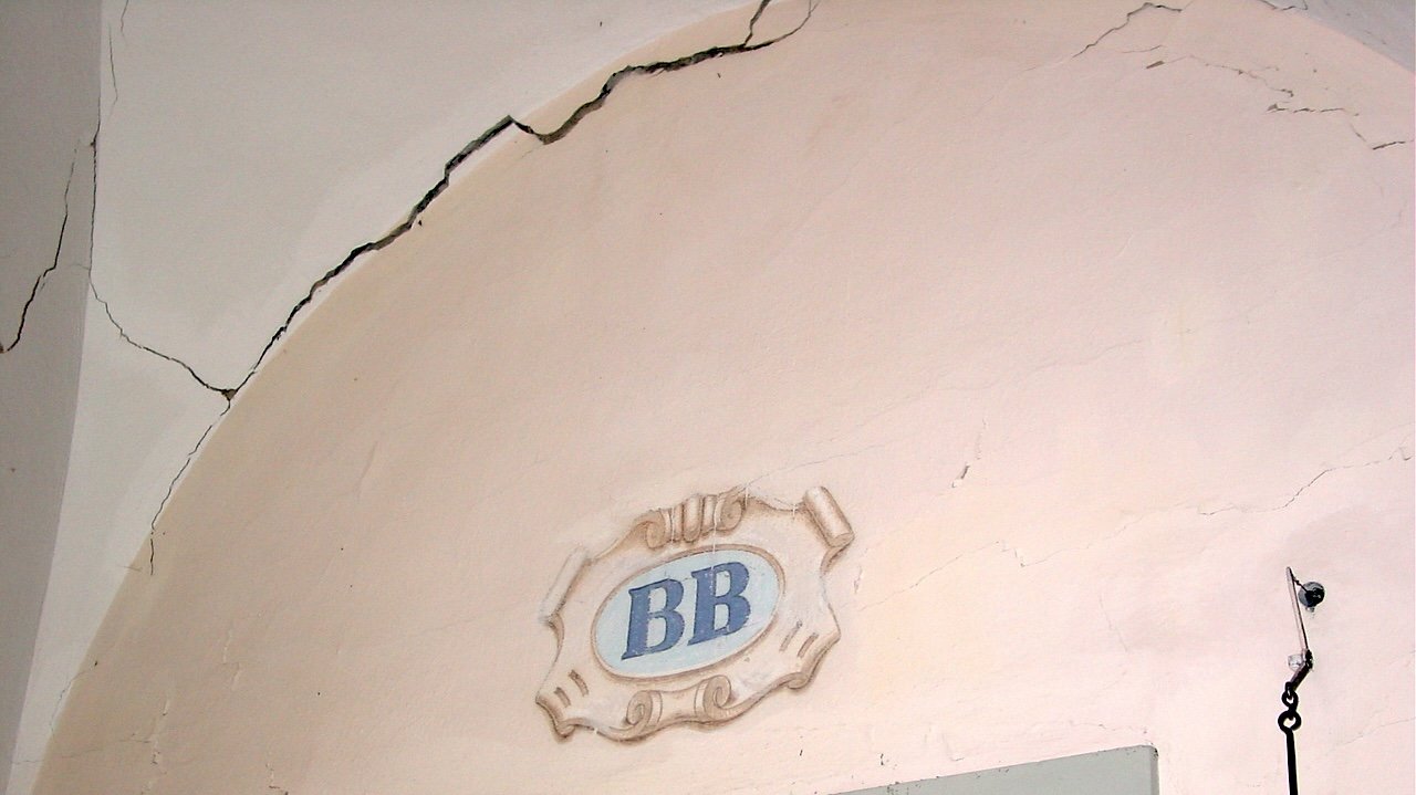 Cracks in the masonry and plaster caused by settlement at La Valsainte Charterhouse, Val-de-Charmey