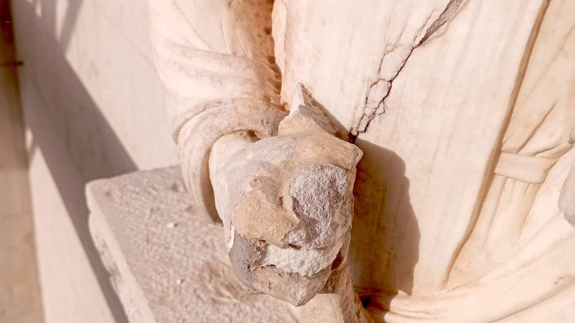 Heat damage to a marble relief at Lugano Cathedral